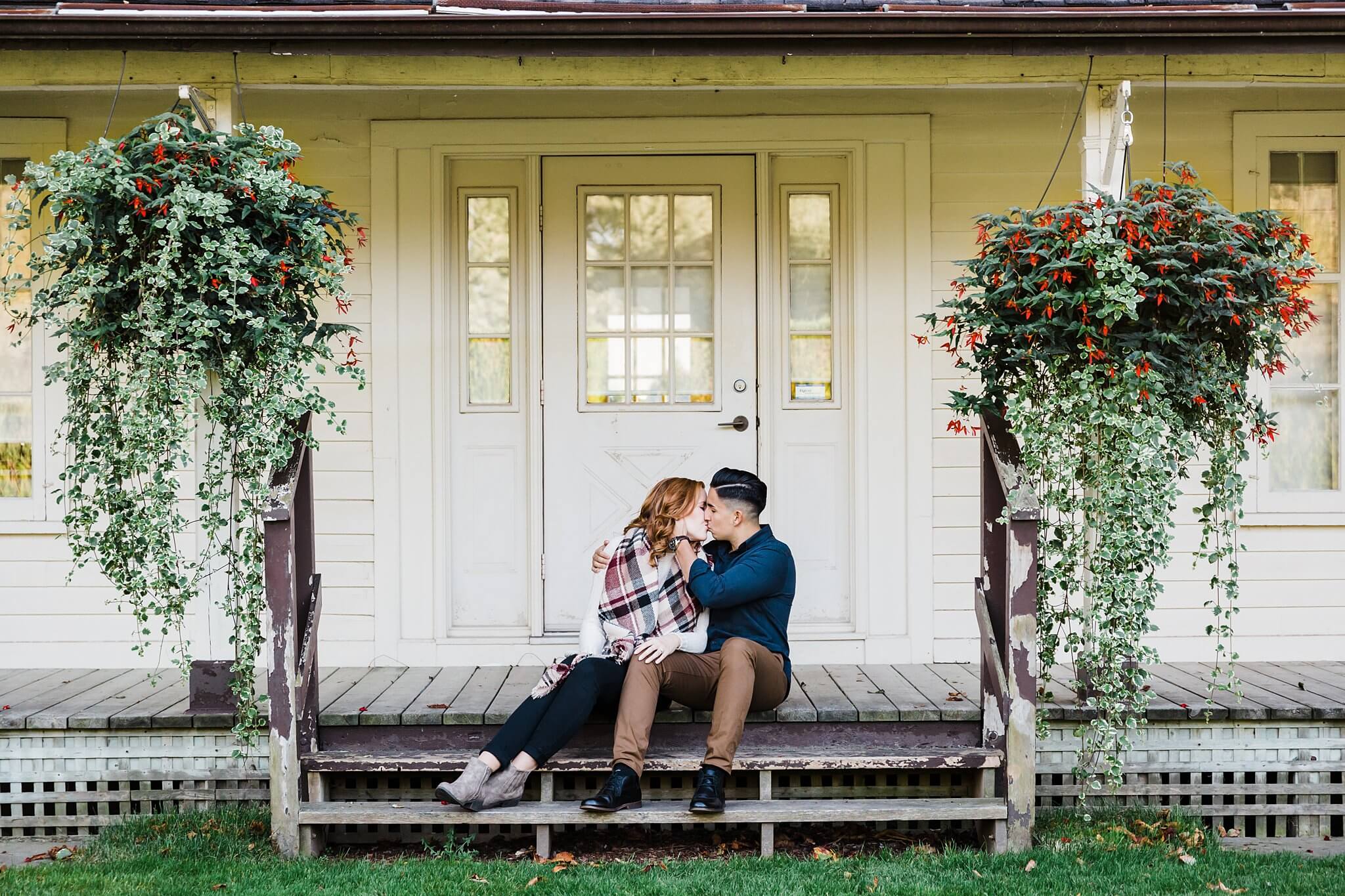 Couple kissing on front porch at the Niagara Falls Botanical Gardens